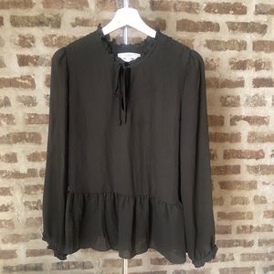 Loft blouse with peplum hem and tie neck.